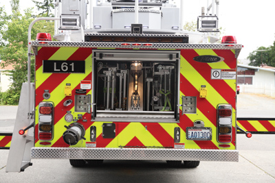 (5) Six ground ladders are nested in an enclosed ladder tunnel at the rear of the new aerial.