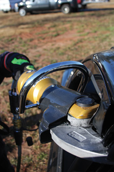 (1) A firefighter uses a Hurst Jaws of Life JL-500 cutter to cut the B-post on a vehicle.