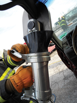 (2) This AMK-22 cutter, made by Amkus Inc., is being used to cut a vehicle's A-post.