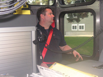 (1) The bright orange seat belt stands out behind dark contrasting backgrounds. This firefighter is seated in position four, directly behind the driver. The officer simply needs to take a quick glance. If the officer can see orange, it's indicative that the firefighter is properly buckled in and nothing needs to be said.