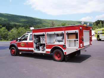 (1) A Hale 4 HPS UHP pump is shown installed on a KME wildland vehicle.