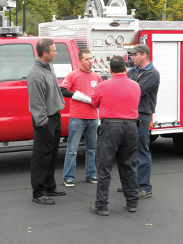 Mark MacDonald, vice president of sales, chats with members of the Canton (MA) Fire Department.