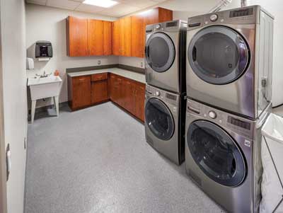 7 The dorm laundry room is for shift and live-in personnel. These units are for normal soiled clothing only. Other laundry units in the station are for contaminated clothing.