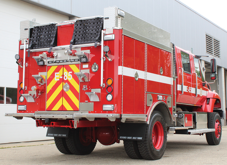 5 The Los Pinos Model 34 Type 3 pumper has hinged, painted exterior compartment doors; a hinged aluminum hosebed cover; and on-beam ladder and hard suction storage.