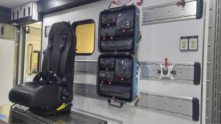 There are three captain’s chairs in the ambulances’ patient boxes, each capable of 180-degree swivel and able to slide forward and back on a track in the floor. This view is of the curbside interior. 