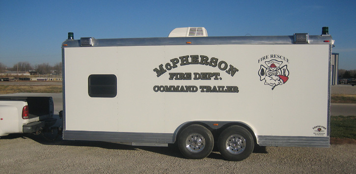 The McPherson (KS) Fire Department had Unruh Fire build this 20-foot bumper-pulled command trailer hauled by a Ford F-250 pickup truck.  