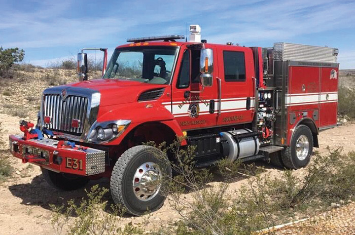 This HME Ahrens-Fox Type 3 wildland apparatus is in service with the Happy Valley (NM) Fire Department in Eddy County. It is built on an International 7400 four-door cab and chassis, is powered by a Cummins ISL9 engine, and features a 1,000-gpm pump.