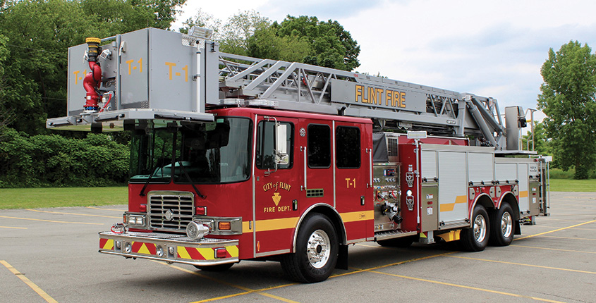 HME Ahrens-Fox—Flint (MI) Fire Department aerial platform quint. Spectr MFDxl cab and chassis; Cummins X12 500-hp engine; Hale Qmax 2,000-gpm pump ; 500-gallon polypropylene water tank; 104-foot aerial platform. Dealer: Matt Creech, Kodiak Emergency Vehicles, Lansing, MI.