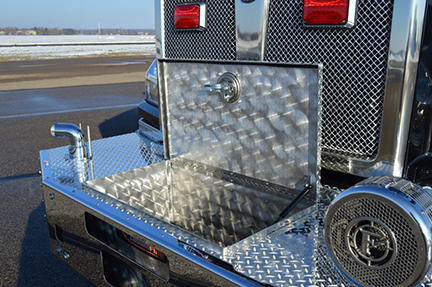 The extended front bumper with covered tray for trash line.