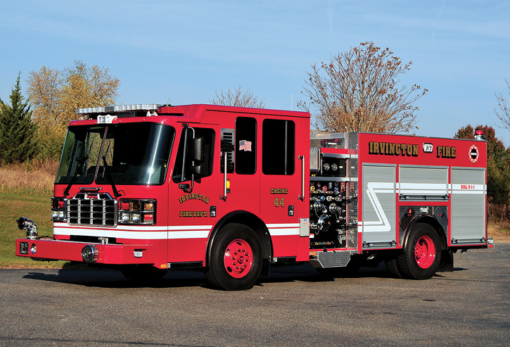 This Irvington, New Jersey, rig has a flat cab, all-red paint job, painted red wheels, and a painted bumper. It also has double high side compartments with slide-in ladder storage, a 1,500-gpm pump, and a 500-gallon tank.