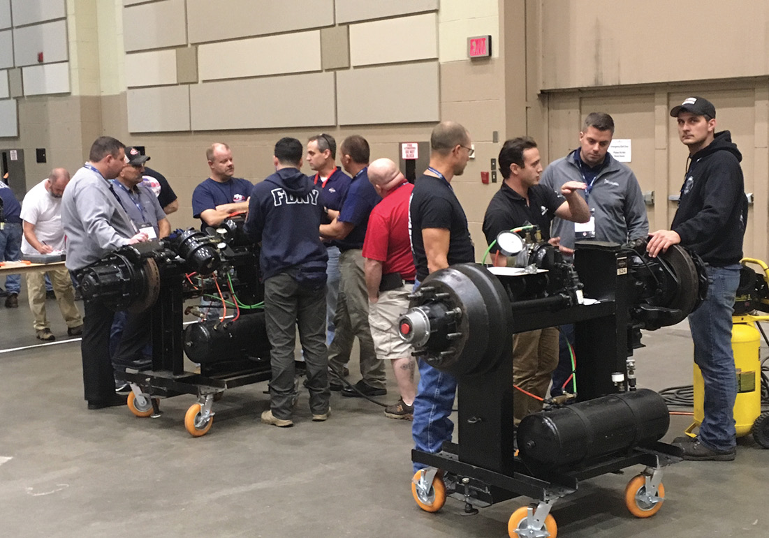 Attendees get hands-on training on chassis components.