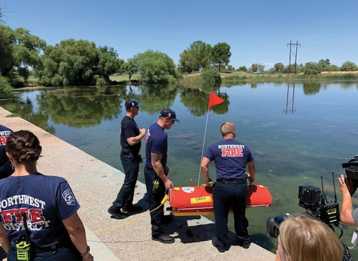 Northwest firefighters prepare to launch EMILY, a water rescue drone, during a training exercise.