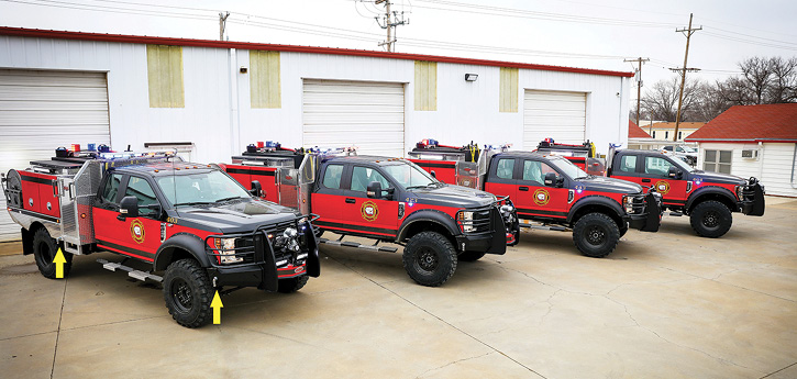 Four identical Quick Attacks on Ford F-450 Quad Cabs for the Pottawatomie County District 1 in Kansas are lined up in front of the Weis “wildland” fabrication shop. These rigs have 300-gallon tanks, onboard foam, and midbody ground sweep nozzles in addition to the two on the front bumper. 