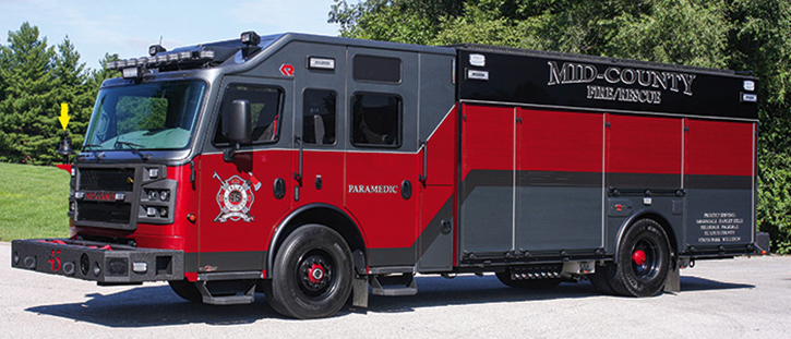 This Rosenbauer 1,500/750 Crossfire pumper operated by the Mid County (MO) Fire Protection District sports gray-red paint on the cab and black-red-gray paint on the body. Preconnects are on both front and rear bumpers. The blacked-out feature includes the bell on the cab front. 