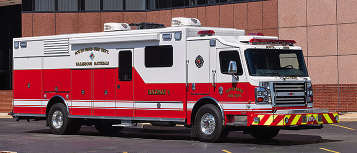 The South Bend (IN) Fire Department runs eight Rosenbauers, including this walk-in hazmat rig on a two-door custom chassis. It has hinged doors, a side entry door, a powered awning, and a light tower.