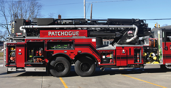 Officer side compartments, with saws, rope, hand tools, forcible entry tools, slide-out tool boards, and extinguishers.