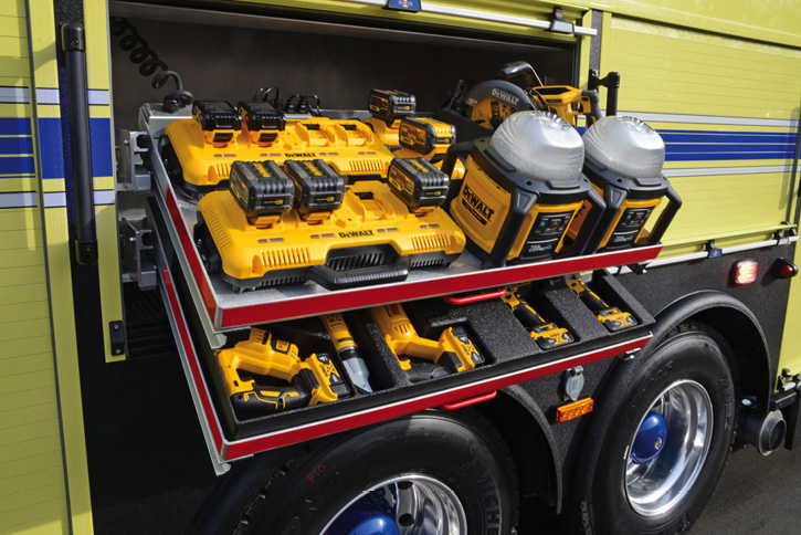 A compartment dedicated to DeWalt battery-powered tools with extra batteries on charge.