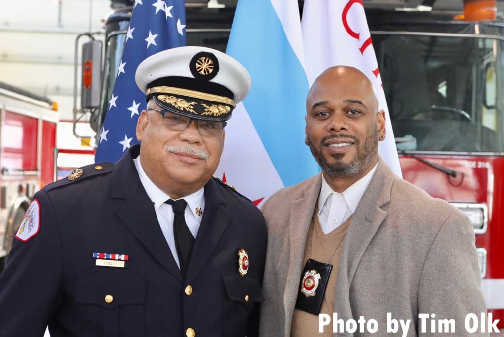 Chicago fire commissioner and dignitary at ribbon cutting for Chicago Fire Department Engine Company 115