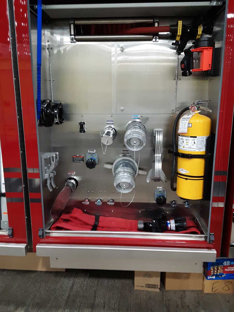 Enclosed officer's side pump panel with reel