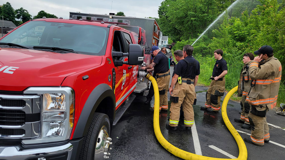 Both trucks are Ford F-550 all-wheel-drive vehicles, each carrying 330 gallons of water, 30 gallons of Class A foam, and capable of pumping 1,250 gallons of water per minute. Squard 3 (pictured here) was put in service back in July. (Dracut Fire Department Facebook page)